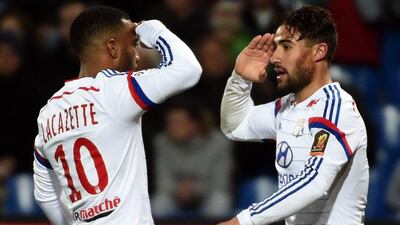 Lyon's Nabil Fekir, right, and Alexandre Lacazette, salute one another after a goal during their 5-1 win over Montpellier in Ligue 1 on Sunday. Pascal Guyot / AFP / March 8, 2015