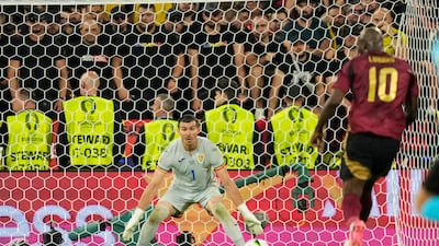 Romania's goalkeeper Florin Nita looks on as Belgium's Romelu Lukaku tucks away a shot that led to a disallowed goal. AP