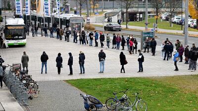 People stand in line to get a vaccination in Salzburg, Austria. AFP