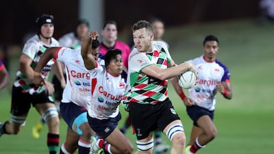 Quins' Mike Pugliese makes a break against Kandy. Chris Whiteoak / The National
