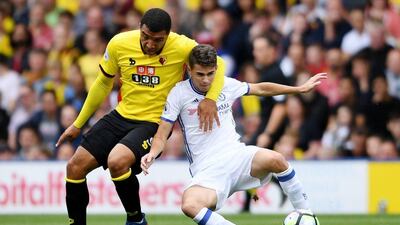 Watford forward Troy Deeney and Chelsea midfielder Oscar tussle for the ball. Tony O’Brien / Reuters