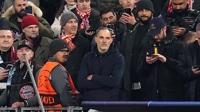 Bayern Munich manager Thomas Tuchel sits in the stands after being sent off. PA