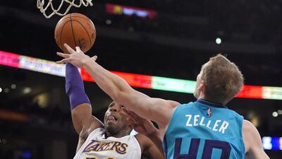Los Angeles Lakers guard Kobe Bryant goes up for a dunk past Cody Zeller on Sunday in the Lakers' NBA win over the Charlotte Hornets. Mark J Terrill / AP / November 9, 2014