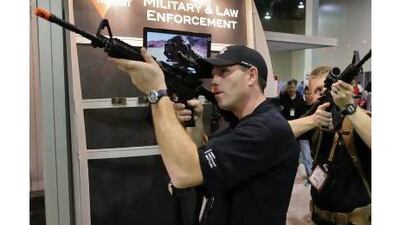 A reader says US president Barack Obama will have difficulty restricting the availability of high-powered weapons, such as these rifles for sale at a tactical equipment and clothing store in Washington state. Julie Jacobson / AP