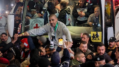 Zakaria Zubeidi is lifted by the crowd as he arrives in Ramallah in a Red Cross convoy after being released by Israel on Thursday. AFP