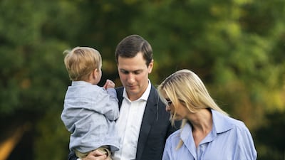 Ivanka Trump, wearing a blue balloon-sleeved blouse and white jeans, walks on the White House's South Lawn with husband Jared Kushner and their sons Theodore and Joseph on July 29, 2018. EPA