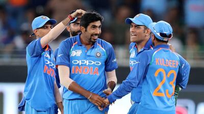 India's Jasprit Bumra celebrates the wicket of Pakistan's Shoaib Malik.