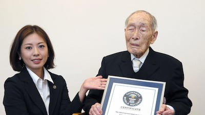 Asked how he felt about the Guinness World Record, Sakari Momoi pushed his back upright and said he wants to live longer: 'Say another two years'. Kyodo News / AP Photo