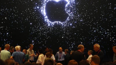 Members of the media await the arrival of Mr Cook in Cupertino. EPA