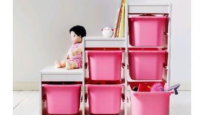 Teaching children to place toys in storage bins helps keep spaces uncluttered.