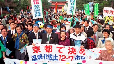 Environmentalists hold banners calling for reduction of green house gas emissions in front of the Heian shrine in Kyoto, western Japan in 1997. AP