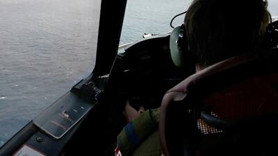 The pilot of a Royal Canadian Air Force maritime surveillance aircraft flies over the Atlantic during the search for the missing OceanGate submersible. Reuters