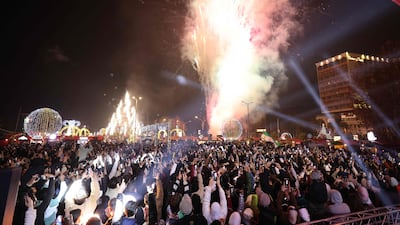 People watch fireworks as they celebrate the start of 2025. AFP