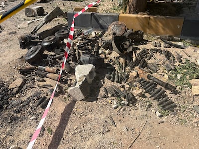 Charred munitions at the site of the explosions in Binnish, north-west Syria. Ahmad Fallaha / The National