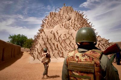 Soldiers of the Malian army patrol the archaeological site of the Tomb of Askia in Gao on March 10, 2020. AFP