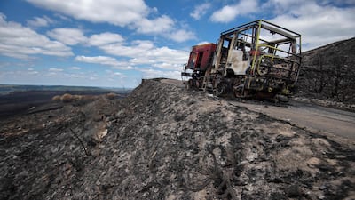 A fire engine burnt in the blaze that hit Brasparts, France. AFP
