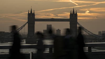 Morning commuters walk across London Bridge in view of Tower Bridge in London. A study this week will show productivity growth in Britain slowed to its lowest level since the onset of the Industrial Revolution. Bloomberg.