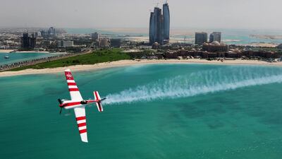 Paul Bonhomme of Britain soars above the Emirates Palace hotel and Etihad Towers during the Abu Dhabi Red Bull Air Race on March 23, 2010 – the last year the race was held. Mike Hewitt / Getty Images