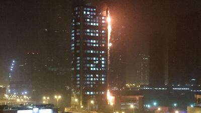The under-construction Kite Residences tower on Reem Island burns late on Sunday evening. Courtesy George Hanna