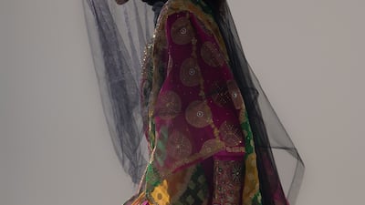 A striped silk kandurah with integrated thawb, circa 2011. Embellished with crystals and metallic threads, it was a gift to The Zay Initiative from Sheikha Fakhra Bint Saeed Al Nahyan, wife of Sheikh Nahyan bin Mubarak Al Nahyan.