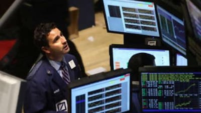 Traders work on the floor of the New York Stock Exchange moments before the closing bell on Oct 20 2008.