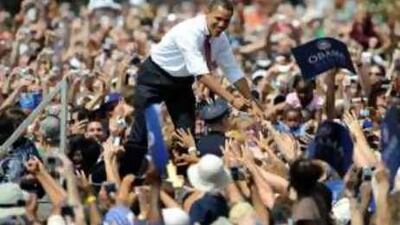 Barack Obama greets supporters at a rally in Illinois to introduce his running mate, the senator Joe Biden.