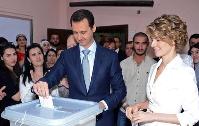 Some observers point to the ascendancy of Bashar Al Assad’s wife Asma, right, and that she might be cleaning house. AFP