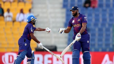 Deccan Gladiators' Kieron Pollard, right, and with Bhanuka Rajapaksa led their team to victory over Karnataka Tuskers in Abu Dhabi T10 at the Zayed Cricket Stadium. Chris Whiteoak / The National