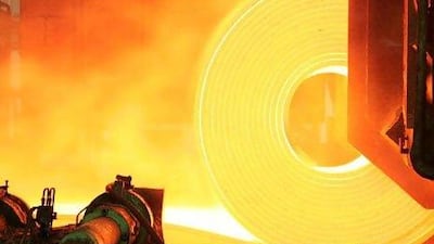 Red hot steel is rolled into coils at the Arcelor Brasil SA steel. (Rich Press/Bloomberg News)