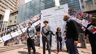 Donald Pols, director of MilieuDefensie (centre) gives a statement outside the court in the Hague after the group won its case against Royal Dutch Shell. Bloomberg