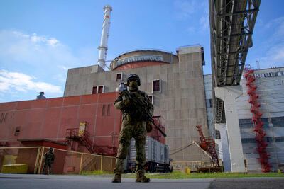 A Russian serviceman stands guard outside the second reactor of the Zaporizhzhia nuclear power station in Energodar. AFP