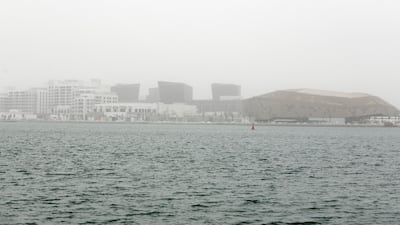 Dusty and cloudy weather at Al Raha beach. Khushnum Bhandari for The National
