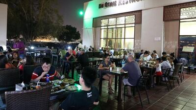 Guests tuck into dinner at the Bu Qtair. Pawan Singh / The National