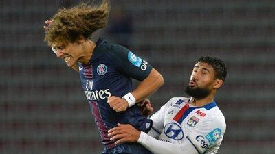 Lyon’s French midfielder Nabil Fekir (R) and Paris Saint-Germain’s Brazilian defender David Luiz vie for the ball during the Trophee des Champions ‘super cup’ match between PSG and Lyon in Klagenfurt, Austria, on August 6, 2016. Samuel Kubani / AFP