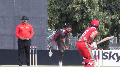 UAE's Kashif Daud bowls to Oman's Kashyupkumar Prajapati during the Cricket World Cup League 2 match at the ICC Academy in Dubai.