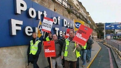 Public sector workers in Britain staged a strike to protest the government's proposed cost-cutting changes in their pension plans. Gareth Fuller / AP Photo