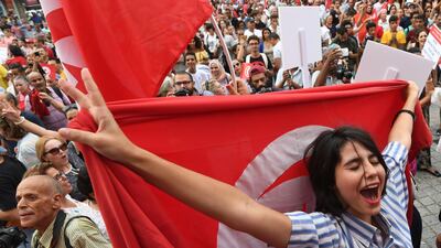 Women at a demonstration to mark Tunisia's Women's Day and to demand equal inheritance rights between men and women.Fethi Belaid / AFP