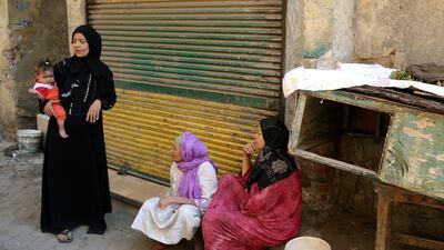Egyptian women sit in front of their homes at the Maspero Triangle slum, Cairo, Egypt, on October 11, 2017. Khalid Elfiqi / EPA