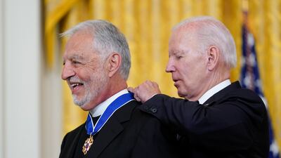 President Joe Biden awards Father Alexander Karloutsos, the former Vicar General of the Greek Orthodox Archdiocese of America, with the Presidential Medal of Freedom, the highest US civilian honour, at a ceremony in the White House's East Room. AP