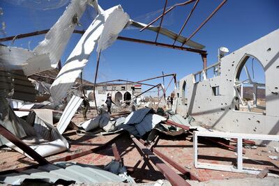 Government soldiers and other people inspect the site of a Houthi missile attack on a military camp’s mosque in Marib, Yemen January 20, 2020. REUTERS/Ali Owidha