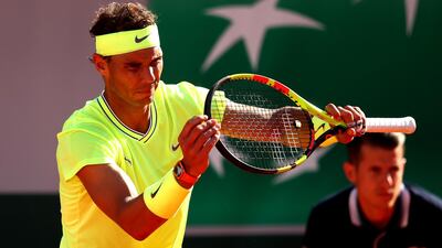 Nadal checks his racket. Getty