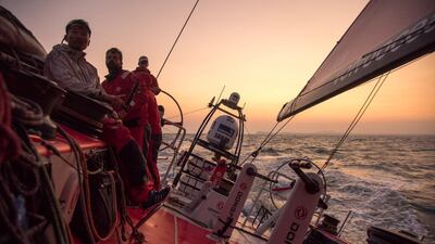 Dongfeng Race Team sail off the Vietnam coast at sunset on Saturday during the third leg of the Volvo Ocean Race to their home port in Sanya, China. Sam Greenfield / Dongfeng Race Team / Volvo Ocean Race / January 24, 2015
