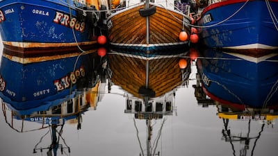 Fishing boats are tied up at Tarbert Harbor in Tarbert, Scotland. Getty Images