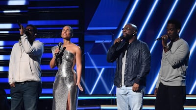 Host Alicia Keys (2nd L) and Boyz II Men sing in honour of late NBA legend Kobe Bryant during the 62nd Annual Grammy Awards on January 26, 2020, in Los Angeles. AFP