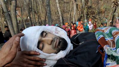 Kashmiri villagers carry the body of suspected militant of Lashkar-e-Taiba, Shabir Ahmad, during his funeral procession in Chingam, some 61 kms south of Srinagar. Rouf Bhat / AFP Photo
