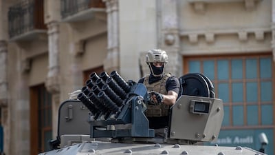 Lebanese Riot police officers sits on his armored vehicle during clashes with anti-government protesters during a mass protest against the economic and financial crisis, and to demand early parliamentary elections, in Beirut, Lebanon. EPA