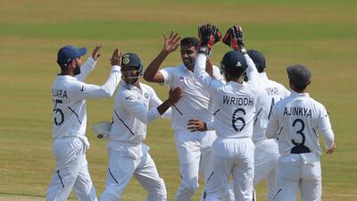Ravichandran Ashwin, centre, celebrates after dismissing Theunis de Bruyn for his 350th Test wicket. AP Photo