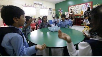 Upper kindergarten pupils join the teachers Talat Naz and Quratal Ain in exercises.