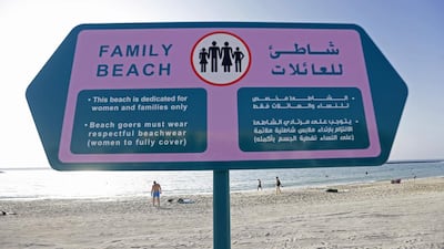 Areas either side of the Dubai Offshore Sailing Club have been declared families-only, with the municipality putting up bright pink signs to mark them out. Jeffrey E Biteng / The National