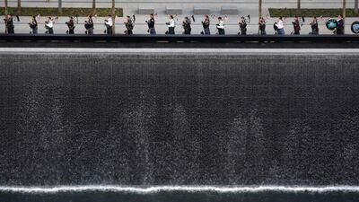 September 11, 2011. Bagpipers perform next to one of the Memorial's twin pools at Ground Zero during ceremonies marking the 10th anniversary of the 9/11 attacks on the World Trade Center, in New York, September 11, 2011. Jessica Rinaldi / Reuters